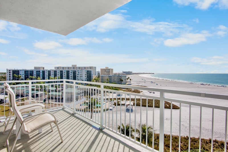 Expansive beach and ocean views stretch endlessly from this elevated balcony, offering a perfect vantage point of the pristine coastline below.
