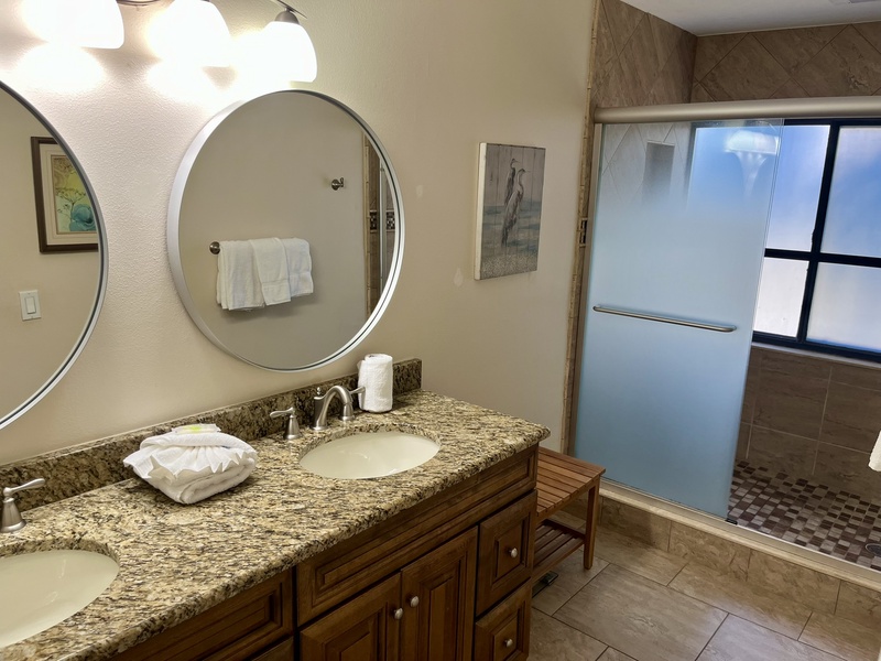 Indulge in your spacious bathroom with dual vanity and granite countertops, perfect for your morning routine together.