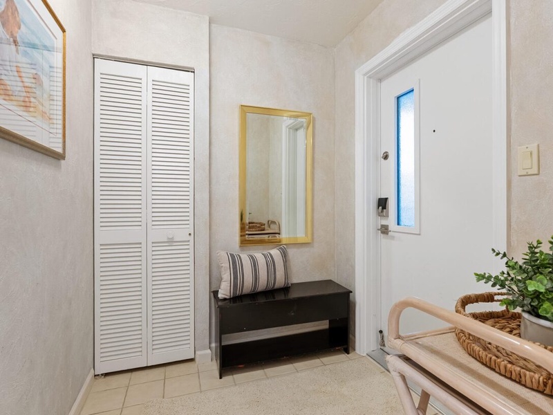 Step into your welcoming entryway with ample storage, thoughtful seating, and charming coastal touches that set the perfect tone for your stay.