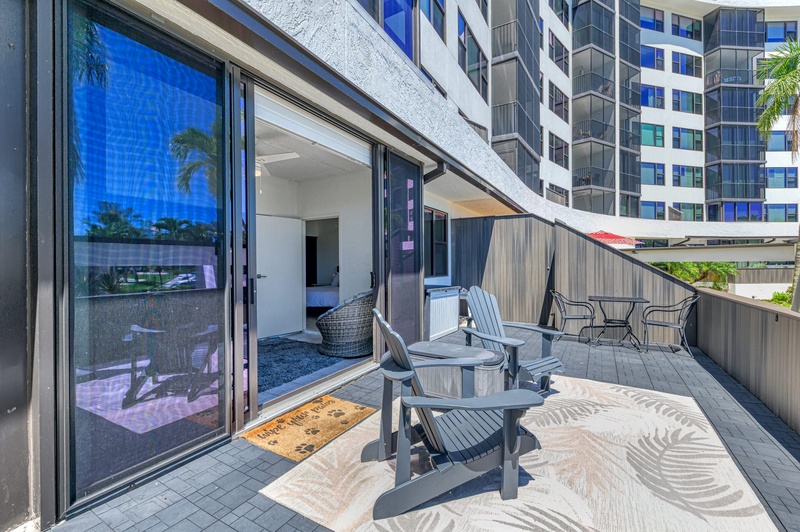 Step onto your private terrace and enjoy morning coffee or evening drinks with modern outdoor furniture and city views.