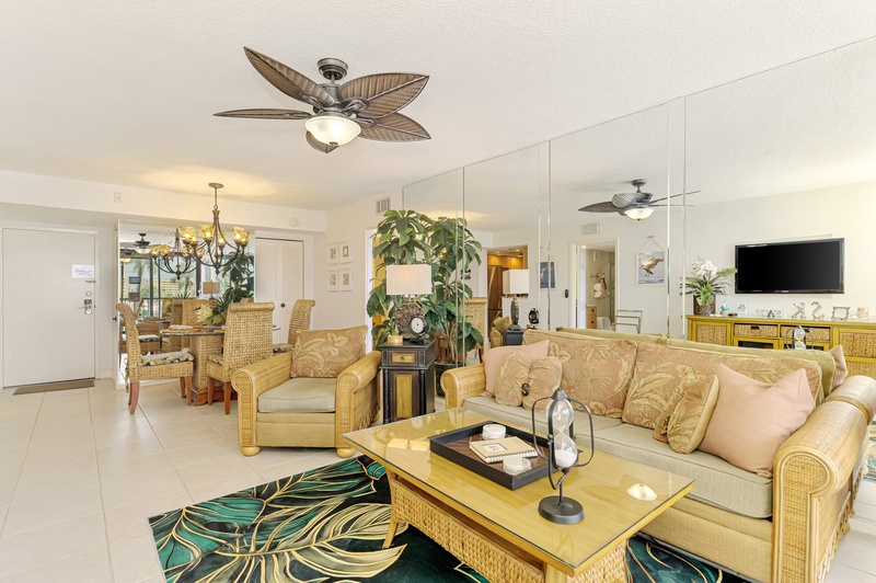 Relax in tropical elegance with coastal-inspired furnishings, ceiling fans, and an open layout perfect for your getaway.
