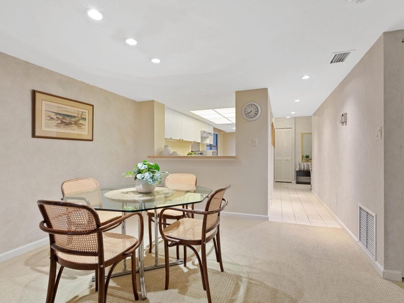 Your bright, open-concept space blends dining and kitchen areas perfectly, with warm lighting and tasteful décor creating the ideal atmosphere for memorable meals.