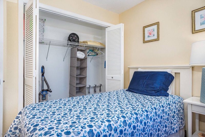 Settle into your cozy bedroom with thoughtful touches like ample closet space, organized storage, and coastal-inspired bedding for peaceful nights.