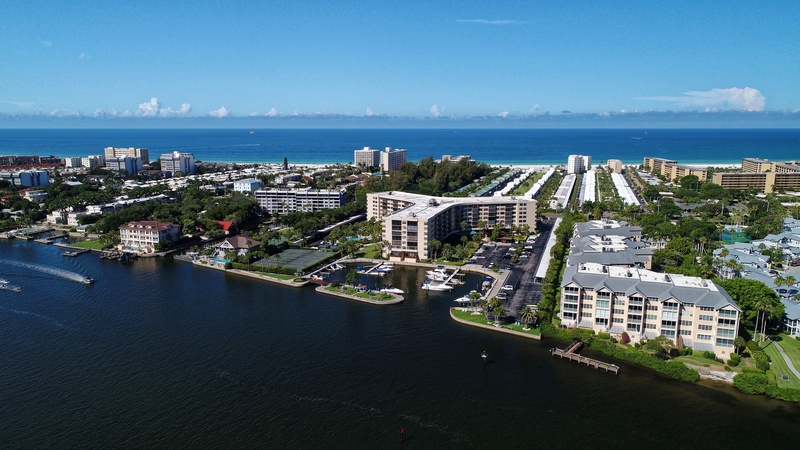 Aerial view of the waterfront community showcasing beachside buildings and coastal development in this scenic coastal destination.