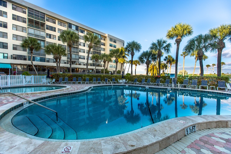 Dive into crystal-clear waters surrounded by swaying palms and modern comfort at your tropical escape.