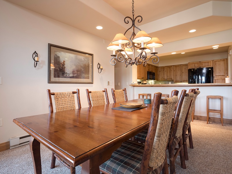 Gather around the spacious dining table, perfect for memorable meals with friends and family. The open kitchen invites easy entertaining and conversation.