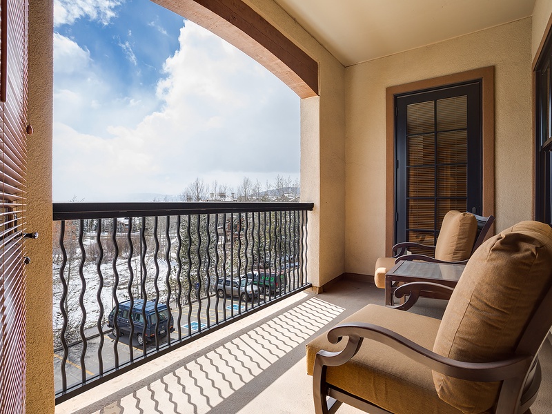 Step onto your private balcony and sink into plush seating while taking in peaceful lake views framed by natural beauty. Your perfect spot to unwind awaits.