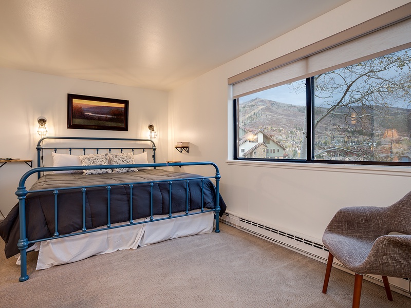 Wake up to stunning mountain views from your cozy bedroom retreat. Sink into the plush bedding and start each morning gazing at the scenic peaks framed perfectly by your window.