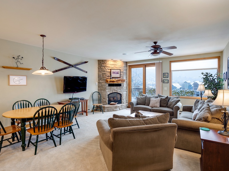 Relax in your cozy living space with a stunning stone fireplace, mountain views, and everything you need to unwind after a day of adventure.