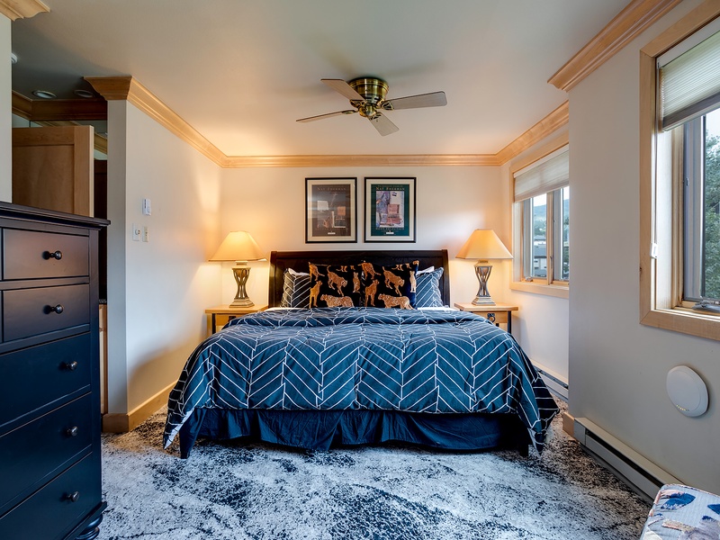 Wake up refreshed in your cozy bedroom, where plush bedding and mountain views create the perfect alpine retreat. Natural light streams through large windows, welcoming each new day.