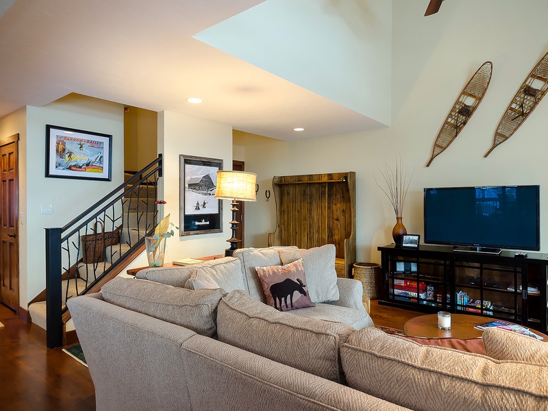 Unwind in your spacious living area with vaulted ceilings, a cozy sectional, and your favorite shows on the large flat-screen. Perfect for relaxing after a day of adventure.