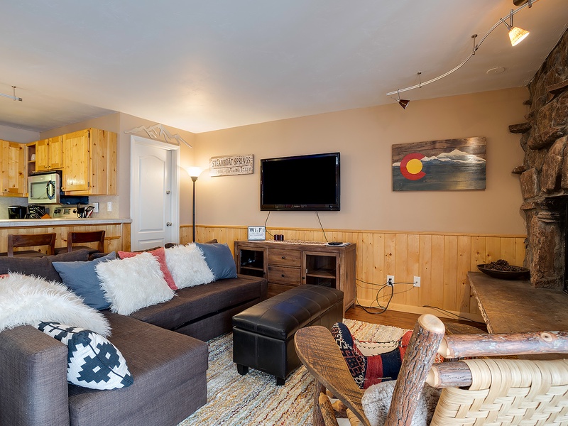Unwind in your cozy living space with plush seating, a warm fireplace, and mountain-inspired touches that invite you to relax after a day of adventure.