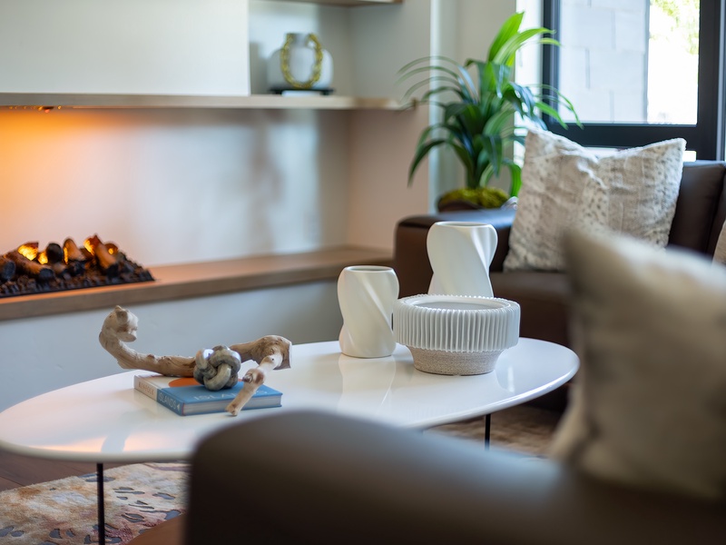 Curl up on the plush sofa with your favorite book while the warm fireplace crackles beside you, creating the perfect retreat after a day of exploring.