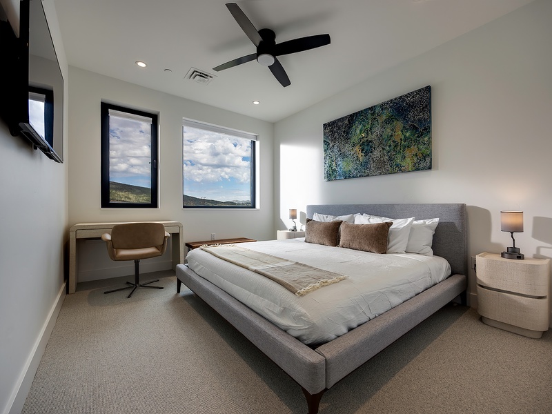 Wake up to stunning mountain views through your bedroom windows, where natural light and modern comfort create the perfect retreat for restful mornings and peaceful nights.