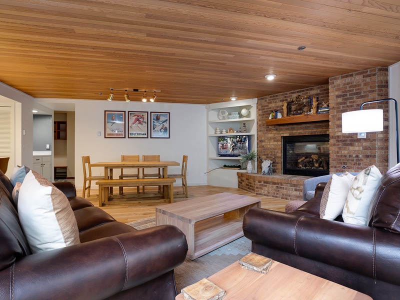Sink into plush leather sofas by the warm fireplace, gather around the dining table, and enjoy your mountain getaway under beautiful wood-paneled ceilings.