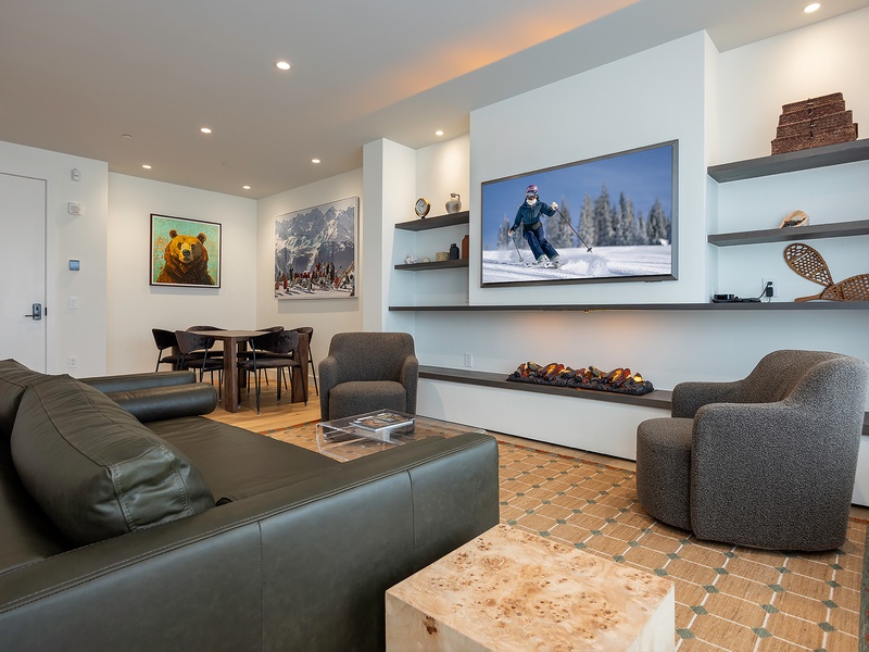 Unwind in your stylish living space, where modern comfort meets mountain charm. Plush seating, ambient lighting, and inviting décor create the perfect setting for relaxing after your day's adventures.