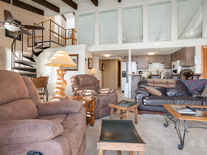 Unwind in your spacious loft with vaulted ceilings and plush seating. The open layout connects living, dining, and kitchen spaces for effortless group gatherings.