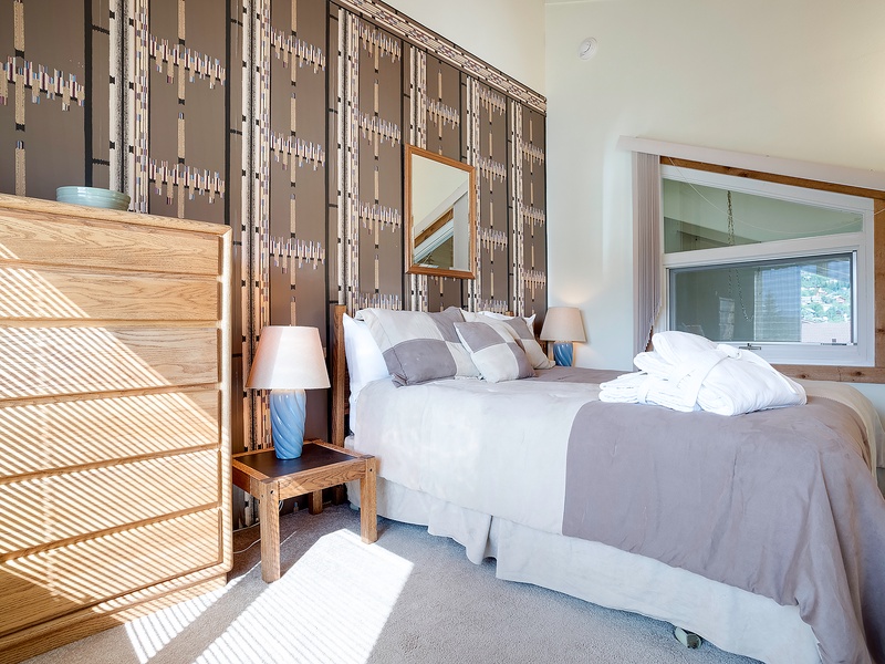 Slip into your tranquil retreat where soft linens and modern design create the perfect sanctuary for rest. Natural light fills the space, inviting you to unwind completely.