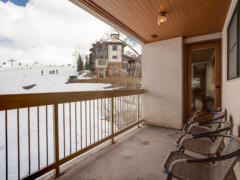 This private balcony provides ski slope views just steps from your door, with seating to enjoy crisp mountain air after a day on the runs.