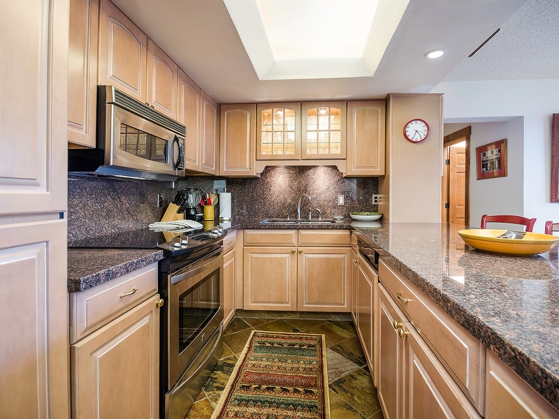 Your fully equipped kitchen features granite countertops, modern appliances, and plenty of prep space—perfect for creating memorable meals during your stay.