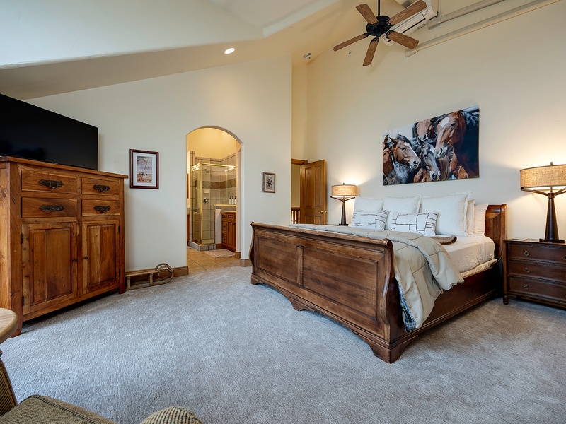 Sink into your peaceful bedroom retreat, with a plush bed, warm wood furnishings, and soft lighting that creates the perfect atmosphere for restful nights.