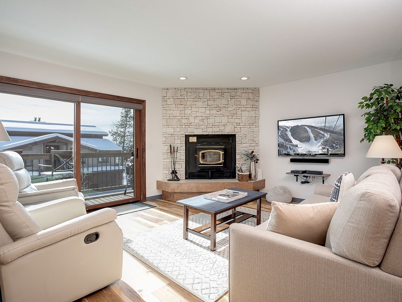 Sink into plush seating by the fireplace and let the mountain views through the patio doors set the tone for your alpine escape.