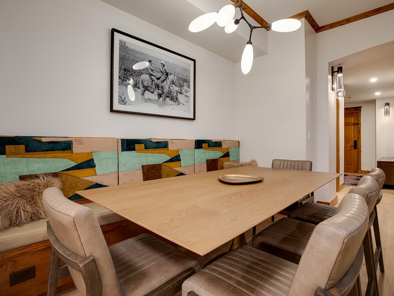 Your elegant dining space blends modern mountain style with plush seating, warm wood accents, and artistic touches—perfect for memorable meals and lively conversations.