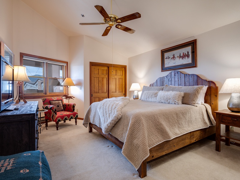 Slip into crisp, layered linens on your rustic wood bed, where vaulted ceilings and gentle lamplight create a peaceful retreat after a day exploring the mountains.