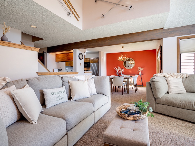 Your spacious open-concept retreat features soaring vaulted ceilings, plush seating, and warm wood accents that invite you to unwind and feel right at home.