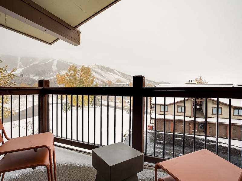 Step out to your private covered balcony and take in peaceful views of the slopes, framed by autumn foliage and mountain peaks—perfect for morning coffee or evening relaxation.