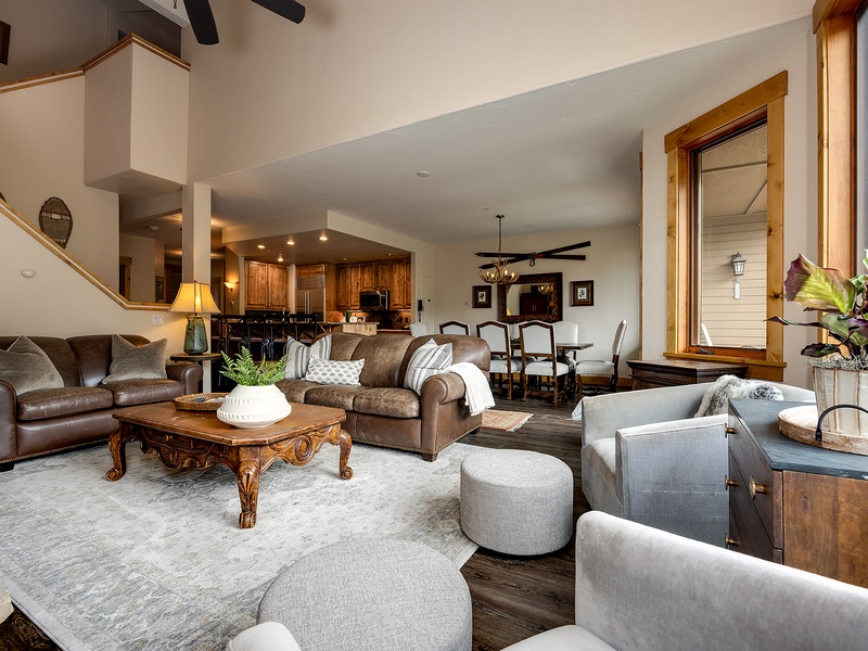 Sink into rich leather sofas and plush seating where rustic wood meets mountain elegance. Your open-concept retreat flows effortlessly from cozy living spaces to the gourmet kitchen—perfect for gathering and unwinding.