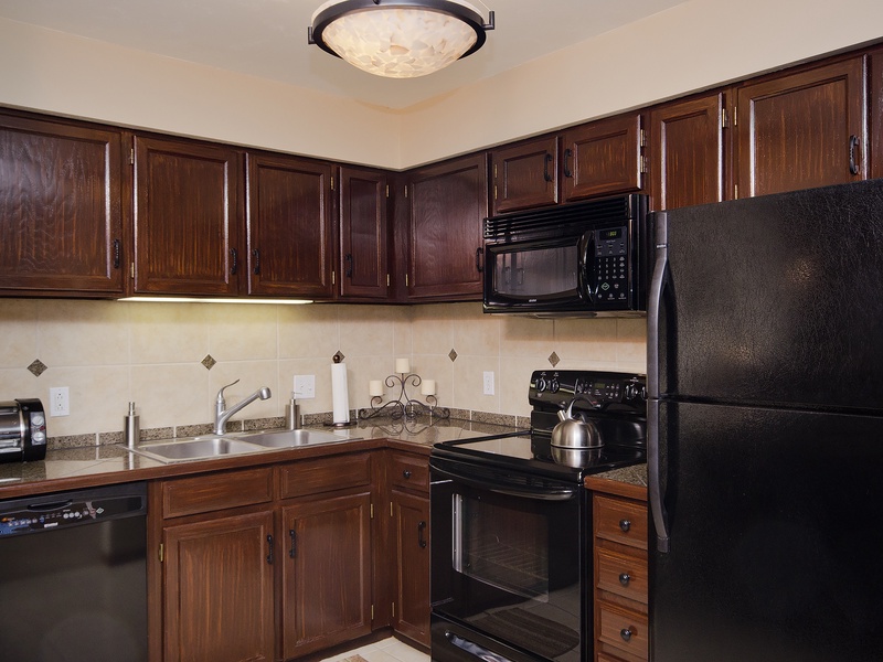 Your fully equipped kitchen features rich wood cabinetry, granite countertops, and all the appliances you need to prepare delicious home-cooked meals during your stay.