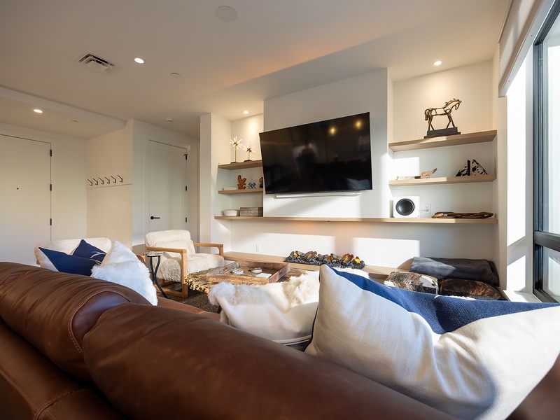 Sink into plush seating and let natural light fill your retreat. This inviting space blends warm textures, stylish décor, and modern comforts to help you truly unwind.