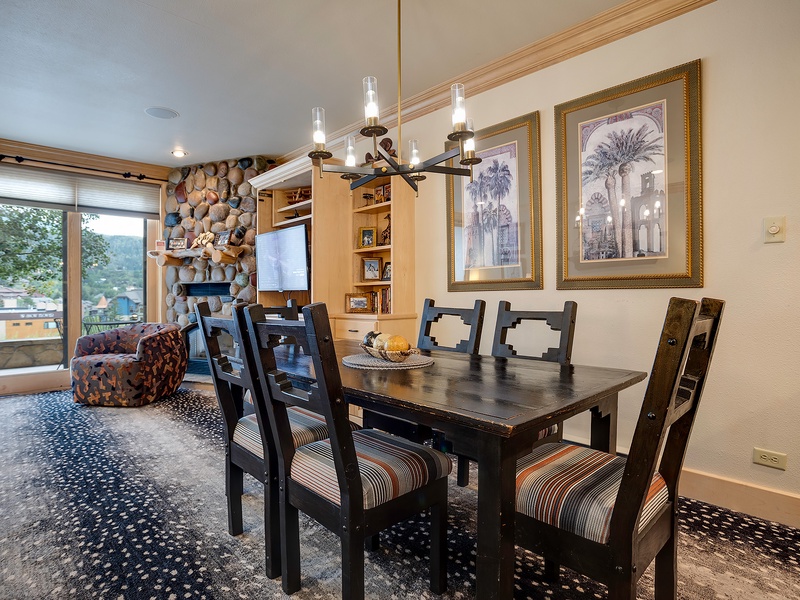 Gather around your private dining table beneath warm lighting, with cozy seating and charming décor welcoming you home after exploring the surrounding mountains.