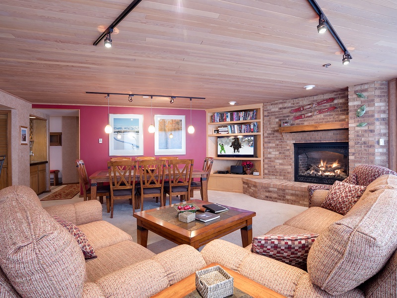 Unwind in your spacious living area with cozy seating, a warm fireplace, and open layout that invites conversation and relaxation after a day of adventure.