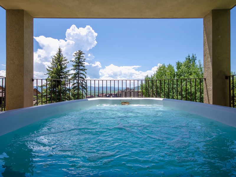 Soak in this private hot tub while enjoying stunning mountain vistas framed by evergreens. Your peaceful retreat under open skies awaits, where relaxation meets breathtaking natural beauty.
