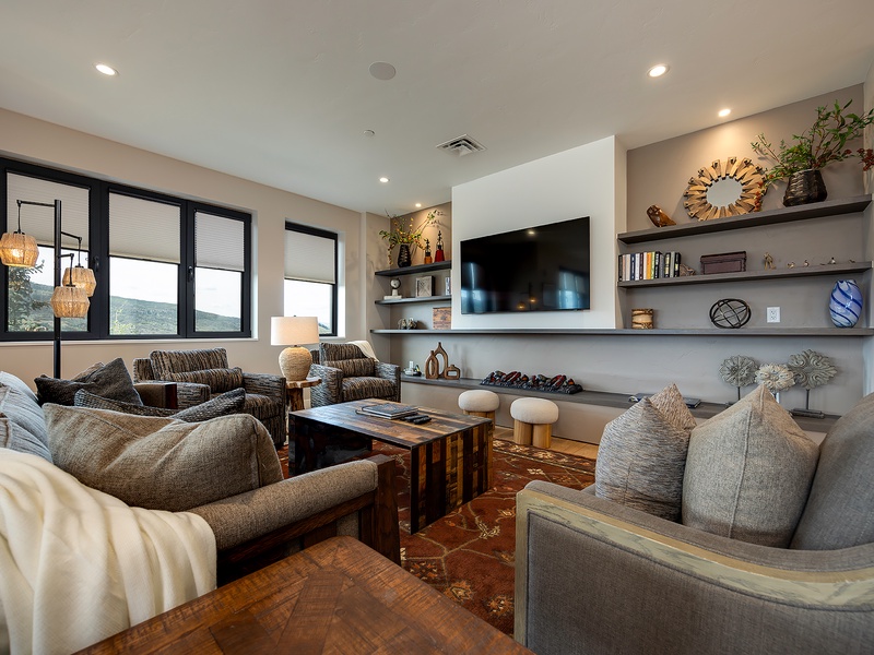 Sink into plush seating and let your worries melt away in this inviting living space, where natural light streams through picture windows and thoughtful decor creates the perfect retreat for your group.