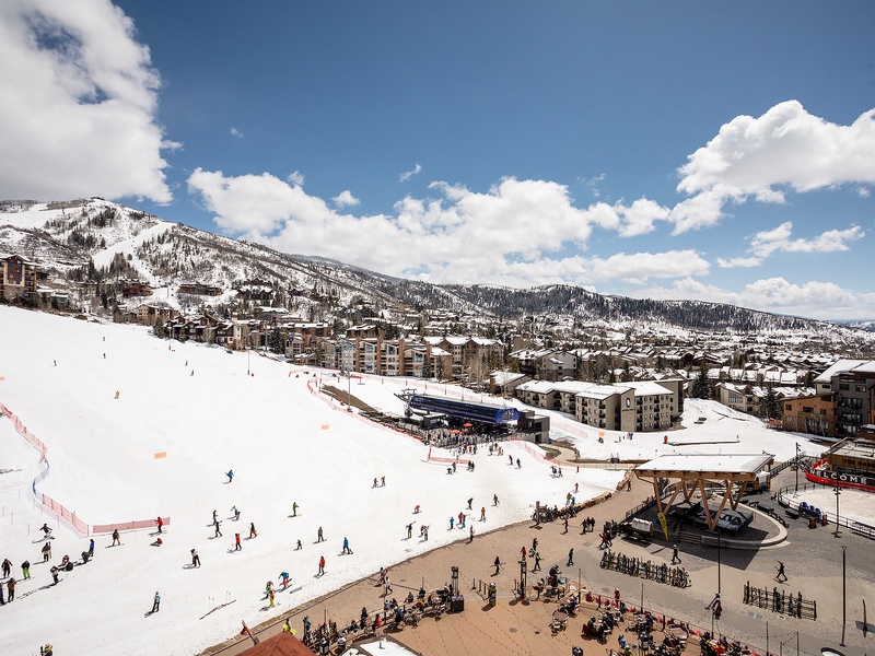 A vibrant ski village nestled at the base of snow-covered slopes, where winter adventure and mountain town charm converge throughout the season.
