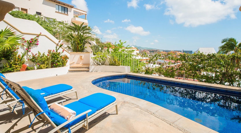 Patio with lounge chairs and pool
