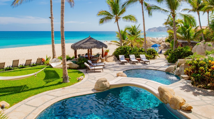 Patio with pool and beach view