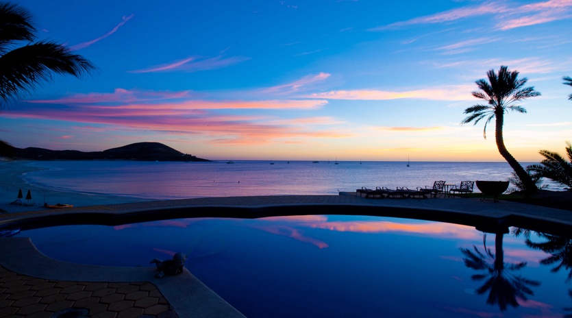 Pool with ocean view during sunset