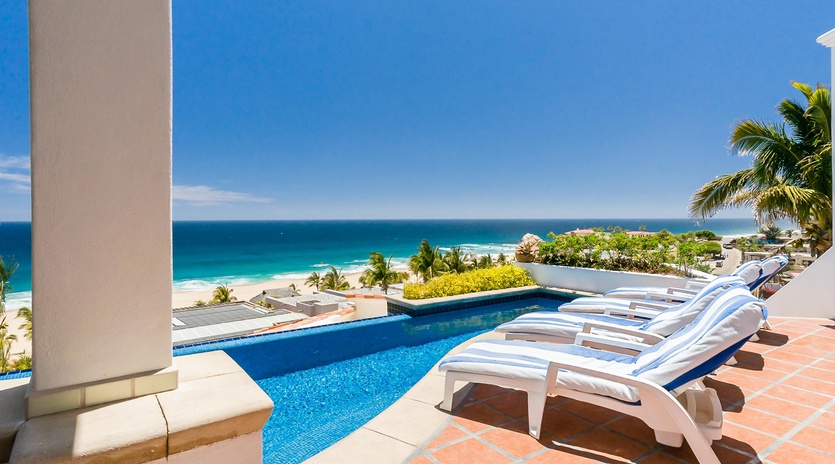 Ocean view patio with lounge and pool