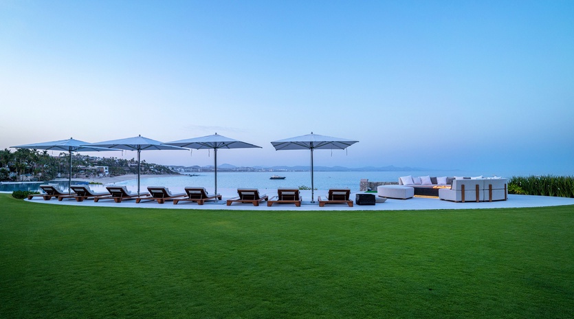 Infinity pool with beachfront views