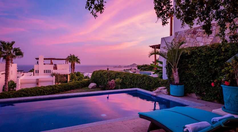 Gorgeous poolside patio with ocean views during sunset