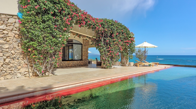 Patio with pool and beach view