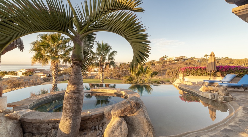 Jacuzzi and infinity pool during sunset