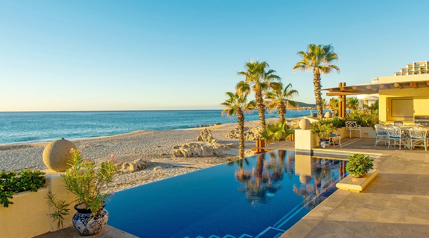 Patio with infinity pool and amazing beachfront views