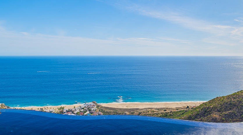 Infinity pool overlooking gorgeous ocean beachfront views