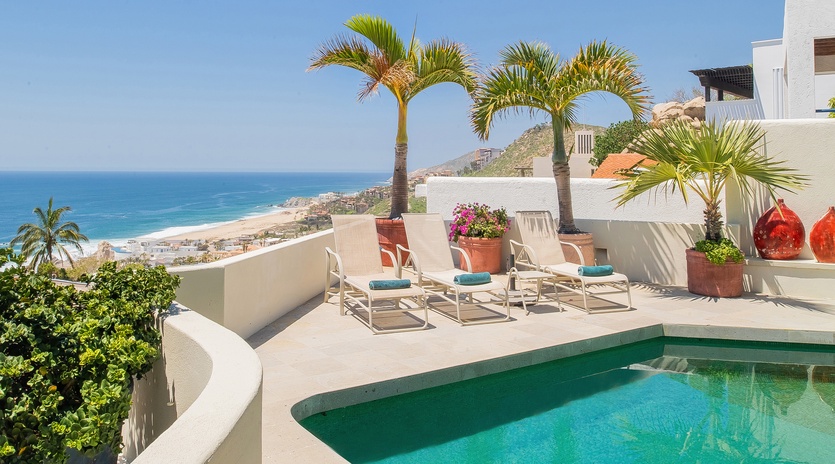 Sunny pool side with ocean view
