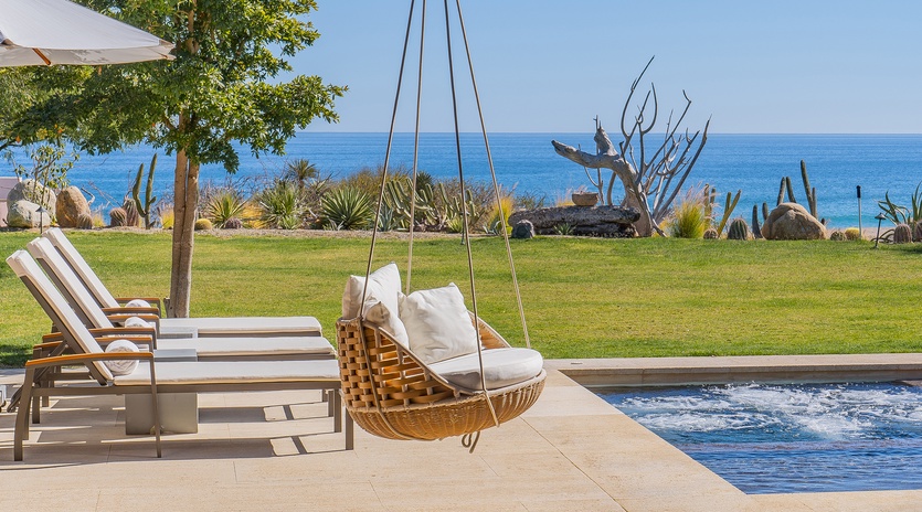 Poolside patio with hammock and ocean view